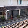 From the very cheap Sama Sama Guest House in Melaka, Malaysia. At 4.45am calls to prayer started from the nearby mosque, then the Chinese temple went off, dogs barked, and at 6am this old man came out hoicking and spitting.