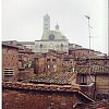 Siena. The guy at the station slipped me the address of this tiny place and it was brilliant, even though it was up five flights and then a stepladder. At night I sat on the tiles outside and watched the dusk fall on the cathedral.