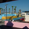 From -- and this is absolutely true -- Fawlty Towers in Cocoa Beach, Florida. Note the subtle colours used on Ron Jon's surf shop next door. This was a migraine every morning.