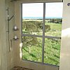 Sea in one direction, snow-capped Southern Alps in the other. At the luxurious Hapuku Lodge, near Kaikoura on the east coast of the South Island, New Zealand. Quite a view from the shower. The lounge one was even better.