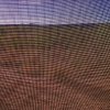 Through the fly-screen in the Australian Outback south west of Alice Springs