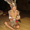 The headman of the Iban longhouse up the Lemanak River, Sarawak, in traditional costume costume offering fermented rice wine. He also wore a very large and expensive looking watch.