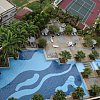 View from a very nice hotel in Melaka.The school on the left however started just after dawn with what sounded like martial disco-anthems as a call for kids to class. NIce abstract of angles and waves looking down though.