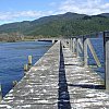 The famously long and shaky Tokaanu Wharf which juts out into beautiful Lake Taupo in New Zealand's North Island. Tiny Tokaanu boasts a fascinating Maori and settler history, cheap property, hot pools and is within a short drive of the ski-fields.