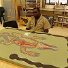 Aboriginal artist at work in remote Wajul Wajul on York Peninsula, Queensland's far north