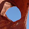 Famous hole in the rock at Monument Valley, not the same one Indiana Jones climbed through. That