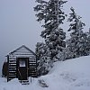 Crater Lake invisible in the snow behind a hut at the top of the mountain in southern Oregon.
