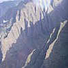 The towering razor-edge cliffs of the spectacular and largely impenetrable Na Pali coast on Kaua'i, one of the Hawaiian islands. This from a helicopter flight over the island, one of the must-do things on Kaua'i.