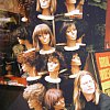 Wigs, hair and Chris Knox's face staring out of a t-shirt. In Spanish Harlem, New York City