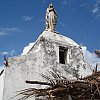 Lonely Madonna on a church on a weather-beaten headland at Lifou in the Loyalty Islands of New Caledonia.